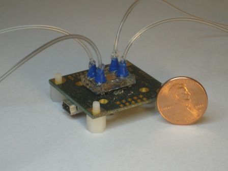Lensfree Sensing on a Micro-fluidic Chip using Plasmonic Nano-apertures